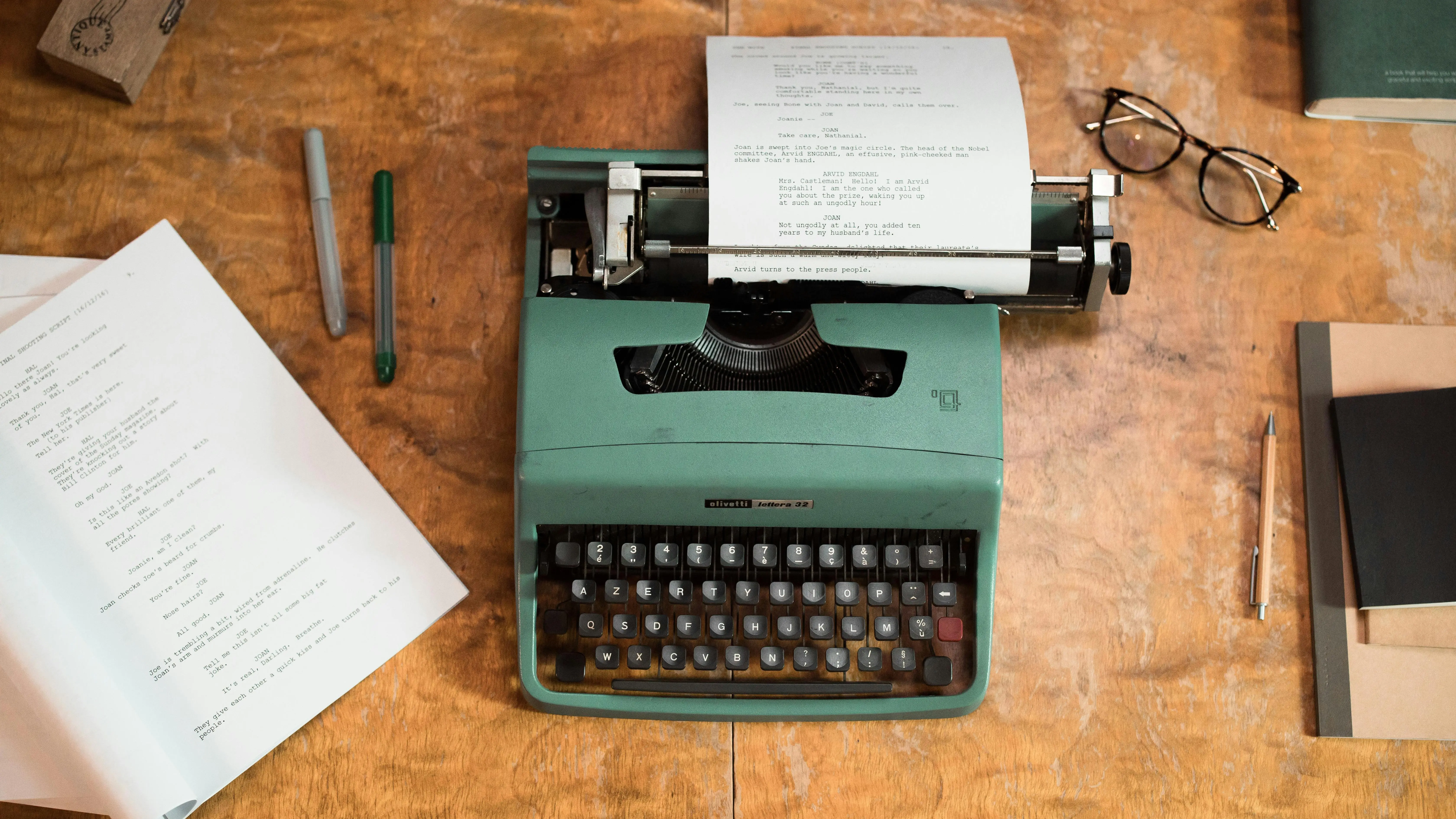Vintage typewriter on wooden table representing film treatments writing process.
