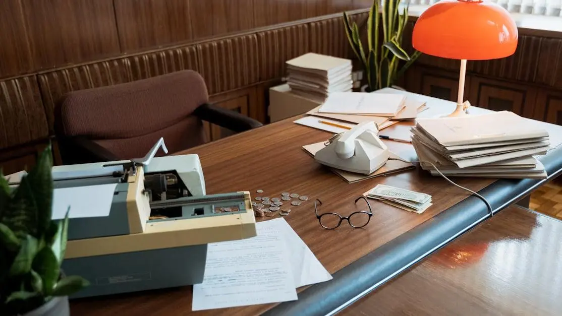 Typewriter on a desk with documents representing great screenplays screenwriters