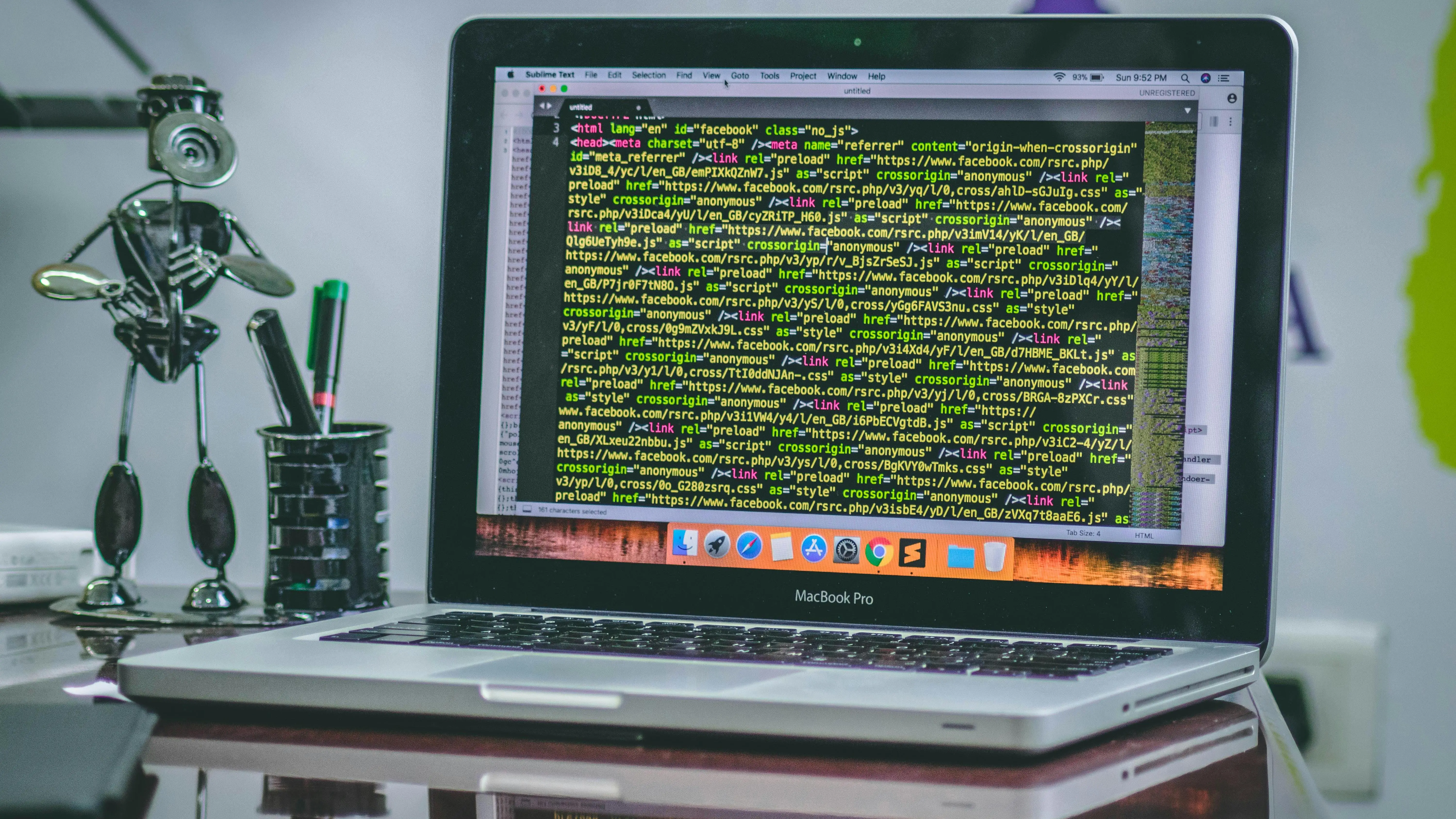 MacBook Pro showing script hosting sites on screen