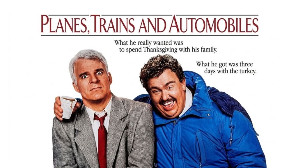 High-resolution movie poster for 'Planes, Trains and Automobiles' featuring Steve Martin and John Candy, used to illustrate a Thanksgiving screenwriting ticking clock mechanism. It shows a frustrated Martin and a laughing Candy against a white background with original taglines.